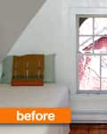 Two twin beds with colorful pillows in an attic room, centered window view.