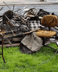 Pile of discarded furniture and debris on grass, including a rusty chair and metal frames, labeled "Before."