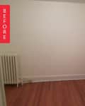 Empty room with wooden floor, black dresser, mannequin with pink fabric, and radiator.
