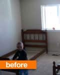 Child standing in a room with two wooden bed frames and a window.