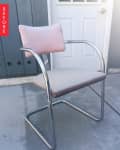 Metal chair with pink cushioned back and seat on a concrete patio, labeled "Before."