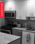 Monochrome kitchen with white cabinets, stainless steel appliances, and a small sink.