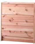 Wooden chest of four drawers with natural finish and round knobs.
