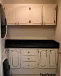 Laundry room with white cabinets, black countertop, and stacked washer-dryer on the left.