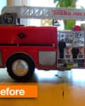 Red and white toy fire truck with "Tonka Fire Rescue" and number 88 on the side, on a wooden surface.