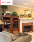 Traditional living room with beige walls, brick fireplace, wooden cabinets, and ceiling fan, featuring plants and framed art.