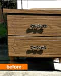Wooden two-drawer nightstand with ornate metal handles labeled "before."