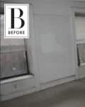 Empty room with beige carpet, radiator, two windows with blinds, and a wall bracket. "Before" label in the corner.