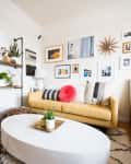 Pictures hanging on the wall in a living room.
