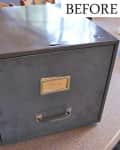Metal filing cabinet on a table with a label holder and handle, marked "Before."