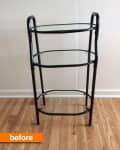 Three-tier black metal and glass shelf on wooden floor, labeled "before."