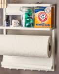 Wall-mounted kitchen organizer with baking soda, paper towel roll, essential oil, and a small cat figurine.