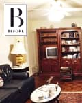 Living room with dark wood entertainment center, vintage TV, leather sofa, brick fireplace, and decorative lamps.