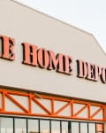 The Home Depot storefront with orange signage and American flags.