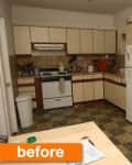 Cluttered kitchen with beige cabinets, white fridge, stove, and cleaning supplies on tiled floor.