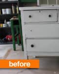 Worn white dresser with three drawers and round knobs in a workshop, labeled "before."