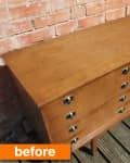 Mid-century wooden sideboard with drawers and cabinets on a deck, brick wall backdrop, labeled "before."