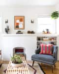 A sun-inviting white living room with colorful decor accents