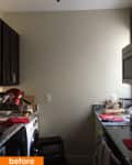 Small kitchen with dark cabinets, granite countertops, and a dish rack.