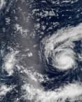Two hurricanes swirling over the Pacific Ocean, captured from space.