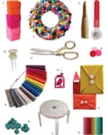 Colorful craft supplies including felt balls, scissors, fabric swatches, and vibrant envelopes with button closures.