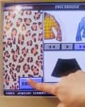 Retro computer screen showing a digital wardrobe with fall fashion options, including a yellow plaid jacket and blue top.