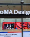 MoMA Design Store entrance with a digital display featuring a drone and countdown timer for La French Tech event.