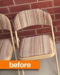 Three beige folding chairs with striped fabric seats and backs against a red brick wall.