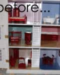 Dollhouse interior with red furniture, including a bed, crib, bathtub, and dining table, across three floors.
