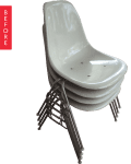 Stack of four white molded plastic chairs with metal legs.