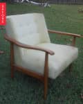 Mid-century armchair with light fabric and wooden frame on grass, labeled "Before."
