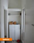 Narrow laundry room with white cabinets, open shelves, baskets, and cleaning supplies.
