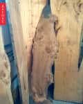 Rough wooden slabs with natural edges and visible grain patterns.