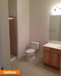 Bathroom with a shower, toilet, wooden vanity, and large mirror, labeled "before."