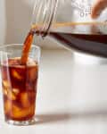 Pouring a glass of cold brew coffee