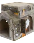 Haunted house-themed cat playhouse with ghost and pumpkin decorations.