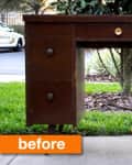 Vintage wooden desk with six drawers and brass knobs, labeled "before," placed outdoors on a concrete path.