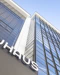 Bauhaus building facade with large glass windows and modern architectural design.