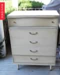 Four-drawer wooden dresser with brass handles on a porch, labeled "Before."
