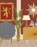 Elegant living room with a gray shell chair, gold accents, lion artwork, sunburst mirror, and decorative plants.