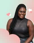 Woman in a sleeveless black top with long braids, smiling against a pastel background with heart graphics.