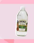 Heinz distilled white vinegar bottle with vegetables on label.