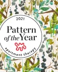Floral and botanical pattern with green, brown, and teal leaves surrounding a "Pattern of the Year 2021" badge.