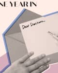 Hands writing "Dear Darshana" on a card with an envelope, text "One Year In" above.