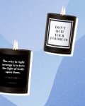 Three black candles with motivational quotes: "Trust Your Dopeness," "Don't Quit Your Daydream," and a quote by Ida B. Wells.