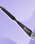 Denman hairbrush cleaning brush with black handle and bristles on a purple abstract background.
