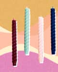 Five twisted candles in burgundy, mint, pink, navy, and orange on a retro geometric background.