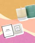 Four scented candles with packaging on a colorful abstract background.
