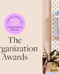 pegboard with things like notepads, pens, chargers hanging on it with the org awards logo