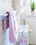 White bathroom with pastel accents